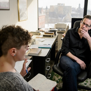 meets with a graduate student in the his office in Helen C. White Hall at the University of Wisconsin-Madison on Feb. 9, 2016. Castronovo is one of twelve 2016 Distinguished Teaching Award recipients. (Photo by Bryce Richter / UW-Madison)