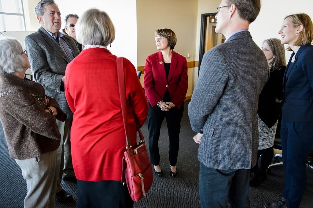 Klobuchar speaks with a group of UW-Madison deans and campus officials.