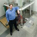 SHINE CEO Greg Piefer with a working prototype of the neutron generator he invented, which will be used to make moly-99 at the planned Janesville plant. 