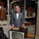Baughman poses in 2007 with 1950s vintage television sets. He was an expert in Journalism history in 20th century and the beginnings of TV in America.