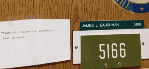 A simple typewritten goodbye was affixed to Baughman's office door in Vilas Hall Monday.