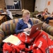 Photo: Student with laptop wearing earbuds