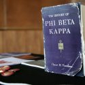 A well-thumbed book of Phi Beta Kappa history welcomes new initiates and their families to the 2016 spring banquet.