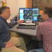 Researchers Andy Alexander (left) and Doug Dean look over and discuss magnetic resonance images (MRI) acquired from an infant's brain. 