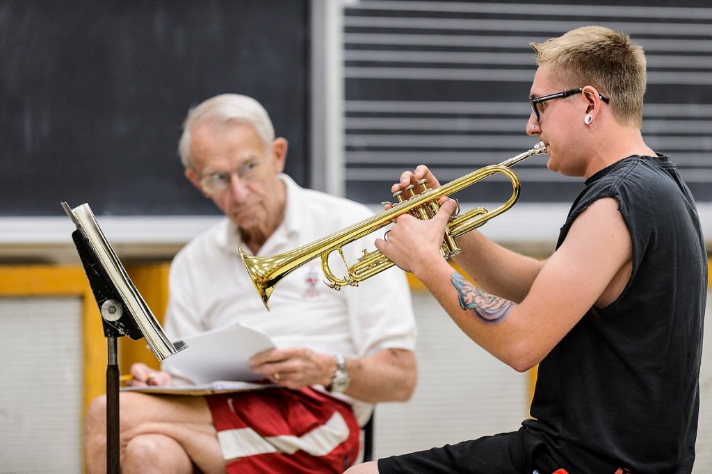 Photo: UW Marching Band Director Michael Leckrone listens intently as incoming first-year student Bradley Bartlett plays trumpet during a brief musical audition in the Mosse Humanities Building.