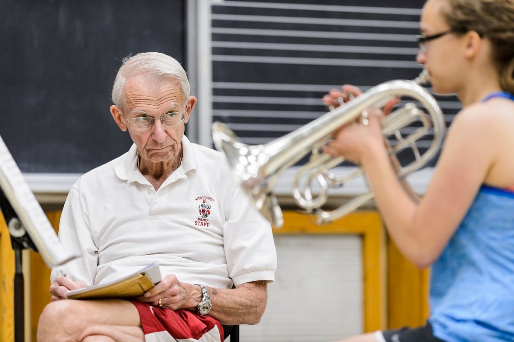 Photo: Leckrone listens for Marching Band potential in incoming first-year student Katie Bina's mellophone audition.