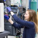 Photo: UW-Madison chemistry graduate student Emily Wilkerson prepares a mass spectrometer to analyze a mitochondrial protein sample.