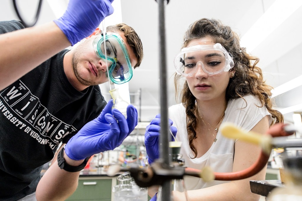 Undergraduates Michael Chemello (left) and Ban Dodin participate in a lab session of an Organic Chemistry 344 class taught in the Chemistry Building.