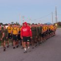 Captain Christopher Murdoch, Commanding Officer, University of Wisconsin Naval ROTC, prepares to lead the battalion in a motivational run