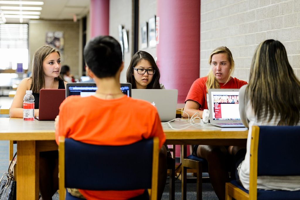 From left to right, undergraduate students Kali Brux, Alice Chen and Natalie Schmer studying and working together with others on a group project at College Library in Helen C. White Hall. The students were curating web-based content for a project about Beethoven for Music 151.