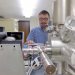 Aaron Satkoski, a scientist in the Department of Geoscience at UW-Madison, with the mass spectrometer used to measure isotopes in rocks from South Africa.
