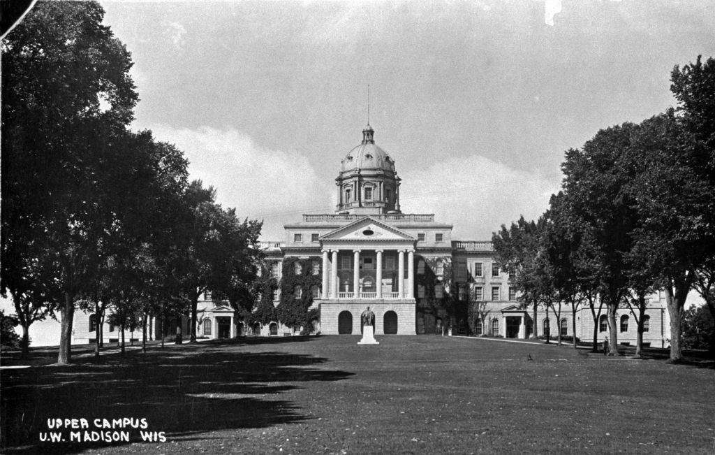 Bascom around 1910, four years after the north wing was completed. Elm trees line the walkways on Bascom Hill, including one (third from left) felled June 29, 2001 to prevent the spread of Dutch elm disease.