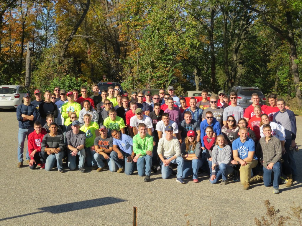 The volunteers pose for a picture at the Frautschi Point entrance.