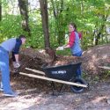 Midshipmen Nicholas Iacovo and Maren Kirkland load up mulch to repair the well-worn trails.