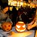 Ming Zhou, right, a graduate student from China studying electrical engineering, and his wife, Qing Chen, carve pumpkins.