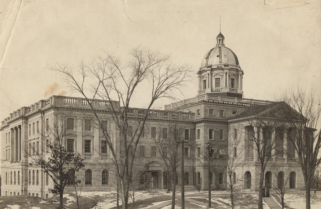 A new dome was built in 1898, and the south wing was completed in 1899; both are visible in this photo.