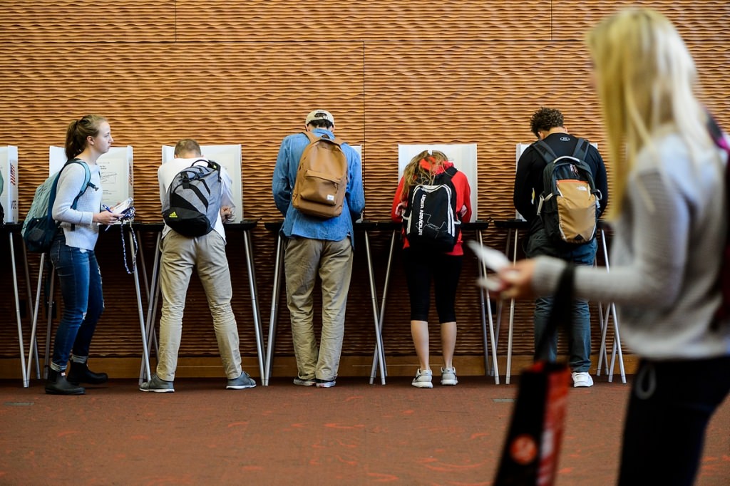 Photo: Students standing in polling booths