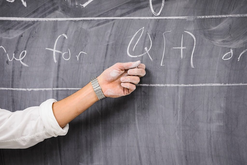 Chalk talk: The guiding hand of Assistant Professor Daniel Erman, one of twelve 2016 Distinguished Teaching Award recipients, leads his students through a lesson in abstract algebra in Van Vleck Hall.