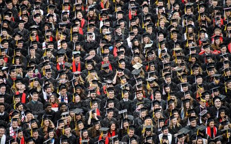 Photo: Students in caps and gowns