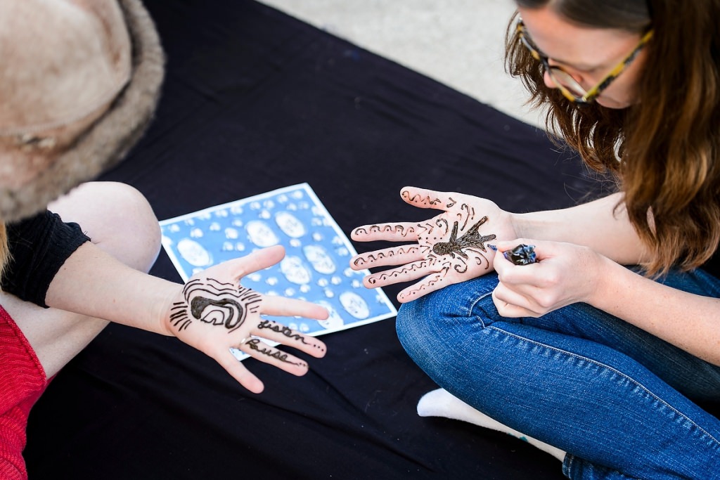 Photo: Students with henna designs on hands