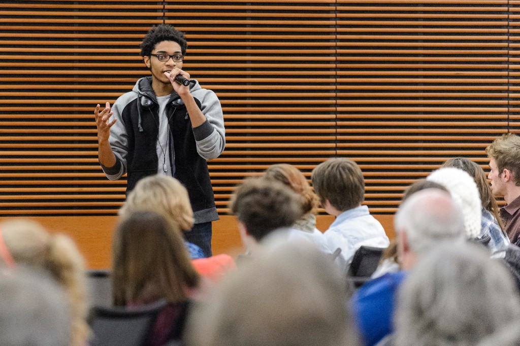 UW student Deshawn McKinney speaks during a public roundtable discussion in 2014.