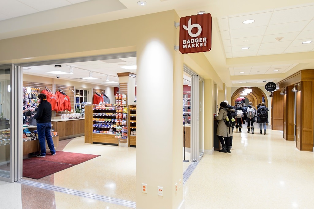 Photo: The former Essentials Store is now a Badger Market with a new, modern look and twice as much space to provide a large selection of grocery and grab-n-go food and beverage items, as well as Badger apparel.