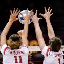 Photo: Wisconsin middle blocker Tionna Williams (11) and setter Lauren Carlini (1) block a shot at the net.