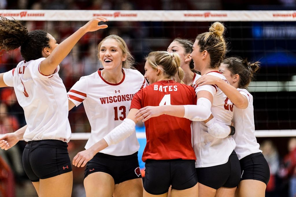 Photo: Wisconsin middle blocker Haleigh Nelson (13) and her teammates celebrate a point.