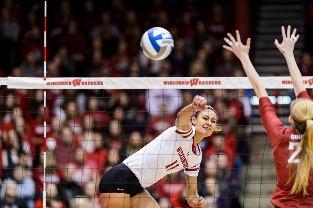 Photo: Wisconsin middle blocker Tionna Williams (11) spikes the ball.
