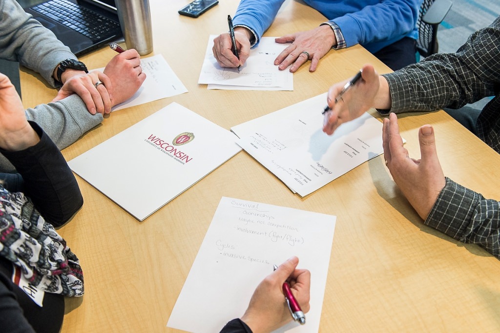 A group of Wisconsin K-12 school science teachers works in teams as they collaborate with UW-Madison staff and experienced computer-game designers during a Field Day Lab mini-game design workshop held at the Wisconsin Institute for Discovery (WID) at the University of Wisconsin-Madison on Jan. 27, 2017. The educational outreach event is the hosted by the Wisconsin Institute for Discovery's Field Day Lab and focuses on designing and creating educational video games for their students and students across the country. (Photo by Bryce Richter / UW-Madison)