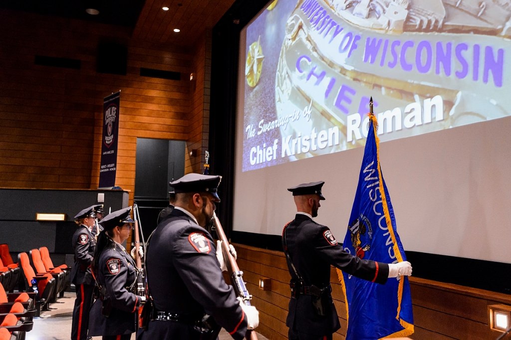 An honor guard sets the State of Wisconsin flag in place before UW Police Department Chief Kristen Roman pledges the Oath of Office during her formal swearing-in ceremony at Union South's Marquee Cinema at the University of Wisconsin-Madison on Feb. 1, 2017. (Photo by Jeff Miller/UW-Madison)