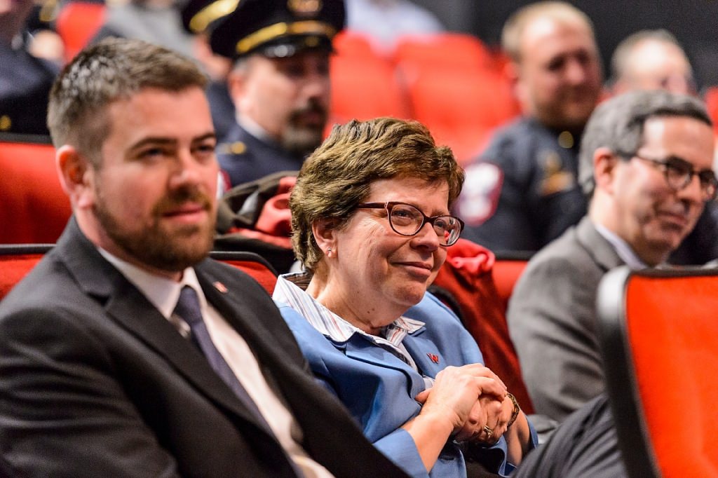 Sitting in the audience, Chancellor Rebecca Blank listens as UW Police Department Chief Kristen Roman pledges the Oath of Office during Roman's formal swearing-in ceremony at Union South's Marquee Cinema at the University of Wisconsin-Madison on Feb. 1, 2017. (Photo by Jeff Miller/UW-Madison)