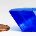 Photo: Bluestone crystal next to a penny for reference
