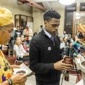 Hazel Symonette, left, program development and assessment specialist in the Division of Student Life, and Marquise Mays (right), chair of the Wisconsin Black Student Union, perform a libation pouring ritual in memory of those who have passed on during a dedication and libation ceremony for the new Black Cultural Center at the Red Gym.