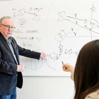 Roger Brown, statistician, and methodologist in the School of Nursing at the University of Wisconsin-Madison meets in Signe Skott Cooper Hall with nursing PhD candidate Dami Ko to assist with her research data on March 16, 2017. Brown is a recipient of a 2017 Academic Staff Excellence Award. (Photo by Bryce Richter / UW-Madison)