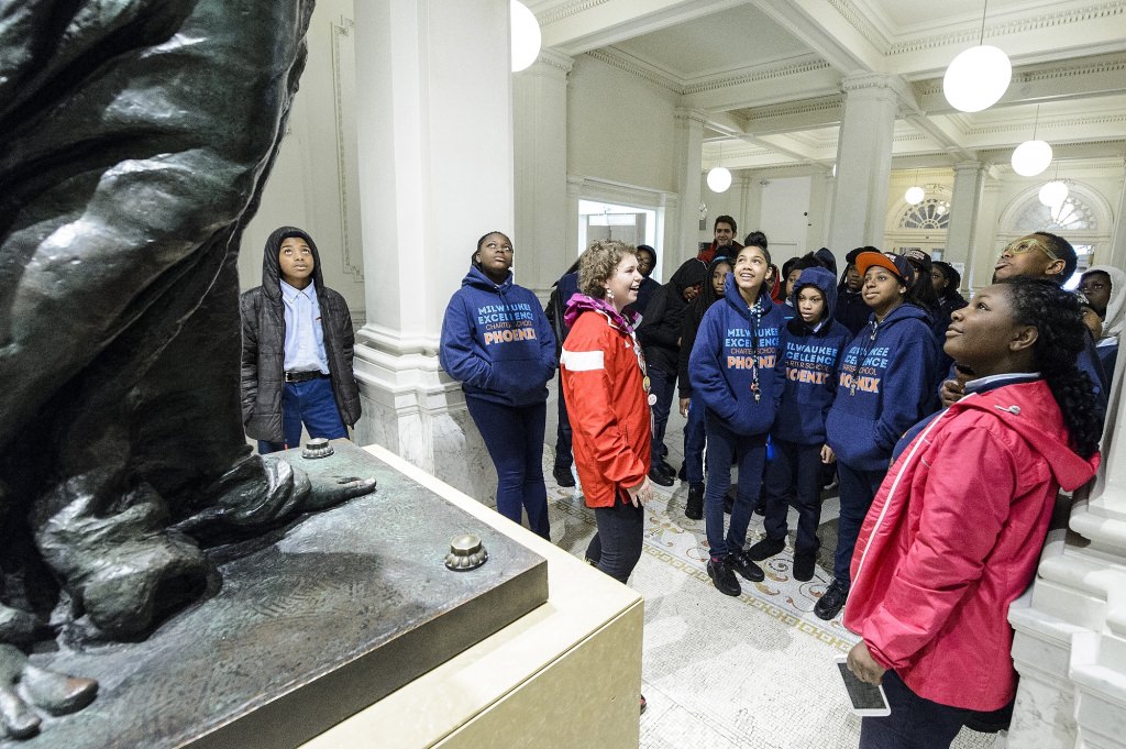 Students from the Milwaukee Excellence Charter School take a tour of the Wisconsin Historical Society lead by UW student ambassador Jenni Geurink (center) during a Bucky's Classroom event at the University of Wisconsin-Madison on April 27, 2017. Bucky's Classroom is a UW outreach program design to partner with K-8 Wisconsin schools to promote the value of higher education and provide classroom resources and an opportunity to directly engage with university students. (Photo by Bryce Richter / UW-Madison)