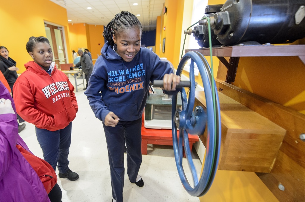 Students from the Milwaukee Excellence Charter School, including Angel Blunt (right), take a tour of the L.R. Ingersoll Physics Museum in Chamberlin Hall during a Bucky's Classroom event at the University of Wisconsin-Madison on April 27, 2017. Bucky's Classroom is a UW outreach program design to partner with K-8 Wisconsin schools to promote the value of higher education and provide classroom resources and an opportunity to directly engage with university students. (Photo by Bryce Richter / UW-Madison)