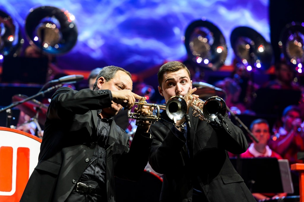 Guest musician Grant Manhart, an alumnus of the UW Marching Band and graduate of UW-Madison, performs "Well, Git It," with his twin sons, Chase, on drums, and Logan, on the trumpet, during the 43rd annual UW Varsity Band Spring Concert at the Kohl Center at the University of Wisconsin-Madison on April 20, 2017. This year's concert, entitled "Nobody Does It Better: 20 Years at the Kohl," comes after band director Mike Leckrone's return to campus following recovery from a medical procedure this past winter. Leckrone is 80 and now in his 47th year at UW-Madison. (Photo by Jeff Miller/UW-Madison)