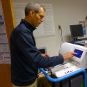 Isomark CEO Joe Kremer demonstrates the steps needed to measure carbon isotopes in a specimen container in Isomark’s instrument. Isomark is a spinoff from UW-Madison.
