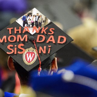 A graduate displays a decorated graduation cap during UW-Madison's spring commencement ceremony at the Kohl Center at the University of Wisconsin-Madison on May 12, 2017. The indoor graduation was attended by approximately 830 doctoral, MFA and medical student degree candidates, plus their guests. (Photo by Bryce Richter / UW-Madison)