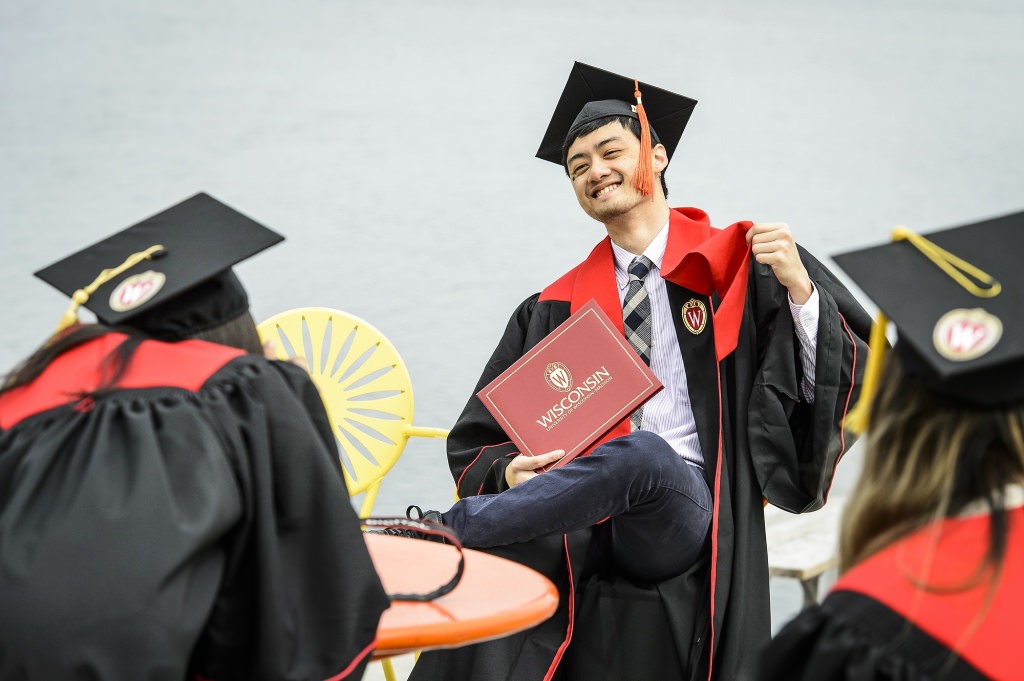 All week, flocks of soon-to-be graduates have covered campus, celebrating and capturing photos of this special time. Jason Hsu exults on the Memorial Union Terrace.