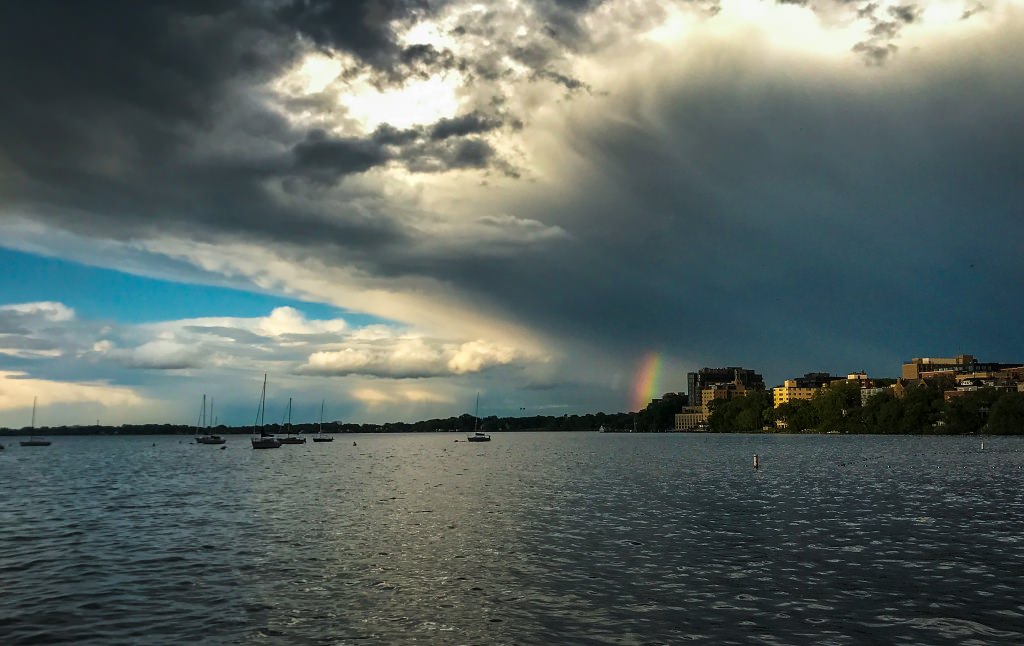 As storm clouds move eastwards, a column of large rainbow appeared besides the Edgewater Hotel next to Lake Mendota. (Photo by Hyunsoo Leo Kim | University Communications)