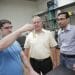 UW–Madison engineers, from left, David Martin Alonso, James Dumesic and Ali Hussain Motagamwala, examine a vial of furfural, one of a group of valuable products the researchers can now create as part of the biofuel refining process. 