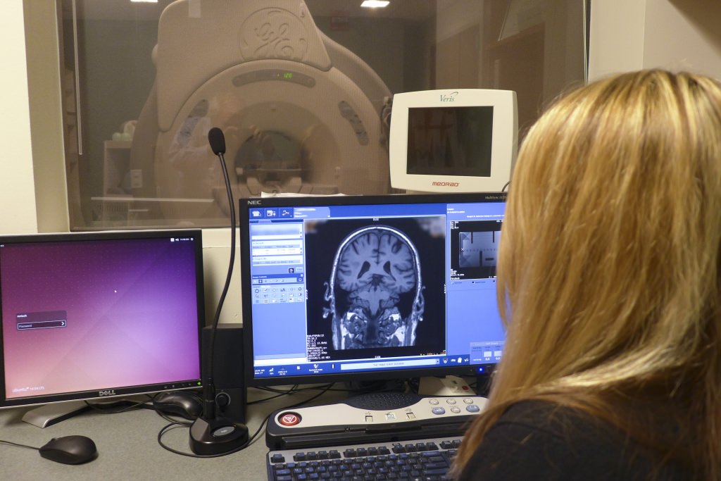Sara John, an MRI research technologist at the UW School of Medicine and Public Health, at work with an MR scanner in the Wisconsin Institute of Medical Research on campus. 