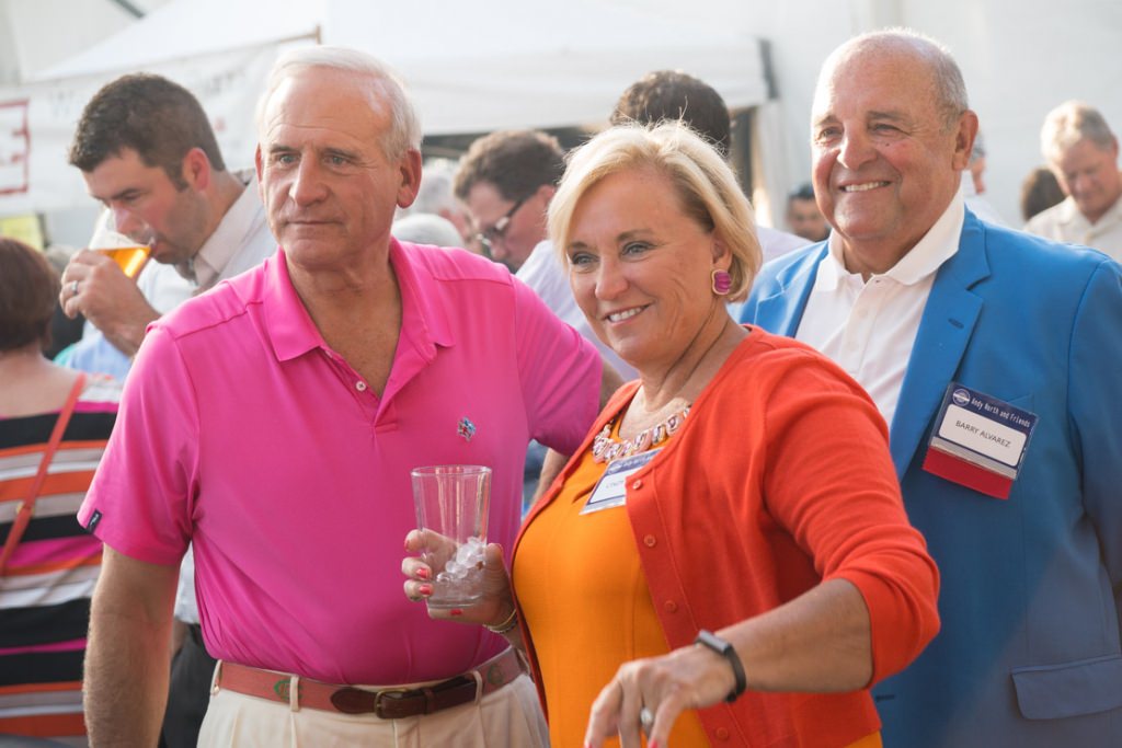 Cindy Alvarez, center, and and Badgers athletic director Barry Alvarez, right.