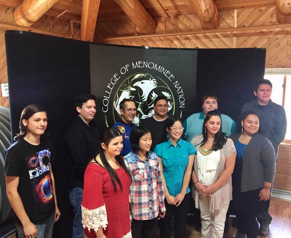 The National Science Foundation grant supported an event that brought John Herrington, the first enrolled Native American (Chickasaw) to fly in space, to CMN and UW–Madison over a three-day visit. Herrington (back row, third from left) met with students and shared his inspirational journey from childhood to his eventual career at NASA and the mission to the International Space Station. 