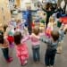 Associate scientist Lisa Flook (right) and former outreach specialist Laura Pinger (left) teach the Center for Healthy Minds Kindness Curriculum to a group of preschoolers at the Waisman Center Early Childhood Program at UW-Madison in 2011. In addition to exploring prosocial concepts like kindness, forgiveness and gratitude, kids are taught mindful movement exercises to build awareness of their minds and bodies.
