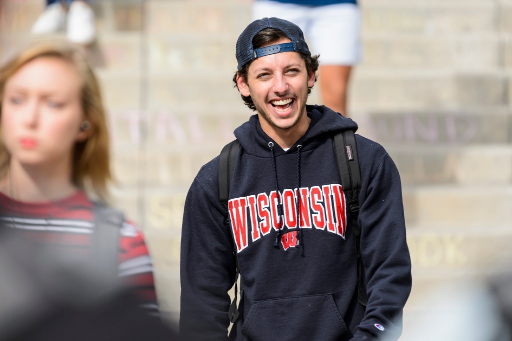 Photo: Smiling student walking down Bascom Hill steps