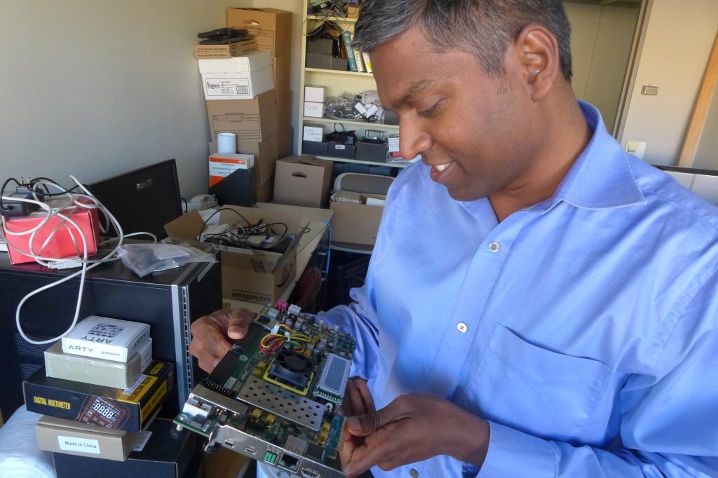 Photo: Karu Sankaralingam examines a prototype motherboard