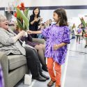 Children enrolled in the Eagle's Wing Child Care and Education Program, present flowers to Debb Schaubs, director of Eagle's Wing Child Care and Education Programs, during a presentation on Aug. 25 to honor her 25th anniversary and retirement.